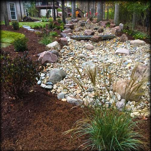 Outdoor Creative Design St. Louis designs and installs stunning water features, hardscapes, retaining walls, landscaping, and more!